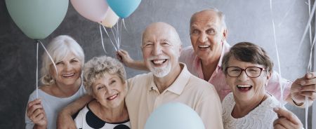 happy; senior friends; balloons